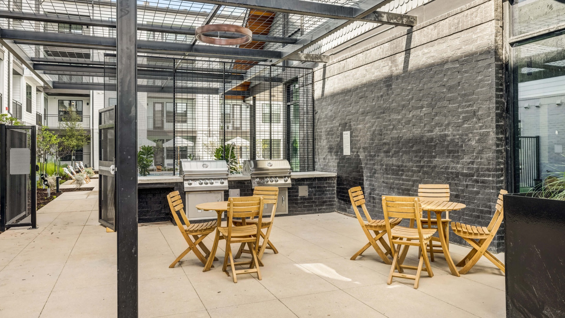 Grilling station with poolside lounge area